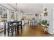 Bright open kitchen with hardwood floors, white cabinets and stainless appliances at 11570 Dunhill Place Dr, Johns Creek, GA 30005