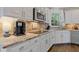 Close up on a bright kitchen with stainless appliances, granite counters, and white cabinetry at 11570 Dunhill Place Dr, Johns Creek, GA 30005