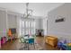 Well lit playroom with a view of the front yard at 11570 Dunhill Place Dr, Johns Creek, GA 30005