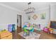 Spacious playroom with lots of room for activities and hardwood flooring at 11570 Dunhill Place Dr, Johns Creek, GA 30005