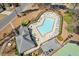 Aerial view of the community pool area with lounge chairs and covered seating at 11570 Dunhill Place Dr, Johns Creek, GA 30005