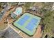 Aerial view of community tennis courts and pool at 11570 Dunhill Place Dr, Johns Creek, GA 30005