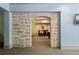Elegant bar area with stone archway that leads to an adjacent entertaining space at 440 Old Homestead Trl, Johns Creek, GA 30097