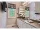 Bathroom with marble countertops and cabinets at 440 Old Homestead Trl, Johns Creek, GA 30097