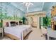 Bright bedroom featuring charming mural, a king-sized bed, and neutral carpet flooring at 440 Old Homestead Trl, Johns Creek, GA 30097