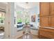 Charming breakfast nook with a bay window, custom cushions, wood cabinets, and overhead decorative lighting at 440 Old Homestead Trl, Johns Creek, GA 30097