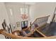 Grand foyer with a winding staircase, chandelier, high ceilings, and a view of the double front doors at 440 Old Homestead Trl, Johns Creek, GA 30097