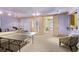 Spacious recreation area with ping pong table, a wet bar, and access to outside at 440 Old Homestead Trl, Johns Creek, GA 30097