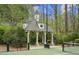 Charming gazebo located adjacent to the tennis court offering a shady spot to relax and watch the game at 440 Old Homestead Trl, Johns Creek, GA 30097