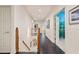 Bright upstairs hallway with hardwood floors, white trim, and decorative display niche at 440 Old Homestead Trl, Johns Creek, GA 30097
