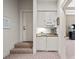 Hallway featuring a beverage station with cabinets, microwave and marble countertop at 440 Old Homestead Trl, Johns Creek, GA 30097