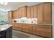 Gourmet kitchen with marble counters, backsplash, wooden cabinets and an island with seating at 440 Old Homestead Trl, Johns Creek, GA 30097