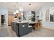 Open concept kitchen featuring an eat-in dining area and stainless steel appliances at 440 Old Homestead Trl, Johns Creek, GA 30097