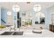 Beautiful kitchen offers an island with a sink, white countertops, stainless steel appliances, and a breakfast area at 440 Old Homestead Trl, Johns Creek, GA 30097