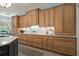 Light filled kitchen with wood cabinets, light backsplash, and stainless hardware at 440 Old Homestead Trl, Johns Creek, GA 30097