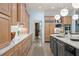 Spacious kitchen with long countertops, a large island, and modern stainless steel appliances at 440 Old Homestead Trl, Johns Creek, GA 30097