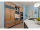 Modern kitchen featuring wood cabinets, stainless steel appliances, and marble countertops at 440 Old Homestead Trl, Johns Creek, GA 30097