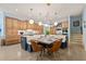 Spacious kitchen featuring a center island with seating, custom cabinets, and stainless steel appliances at 440 Old Homestead Trl, Johns Creek, GA 30097