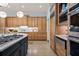 Bright kitchen featuring custom wood cabinetry, stainless steel appliances, and a large island with a gas cooktop at 440 Old Homestead Trl, Johns Creek, GA 30097