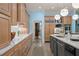 Stylish kitchen with island, marble countertops, stainless steel appliances, and custom wood cabinetry at 440 Old Homestead Trl, Johns Creek, GA 30097
