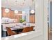 Open kitchen with an eat-in table, pendant lights, and banquette seating at 440 Old Homestead Trl, Johns Creek, GA 30097