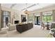 Bright living room with coffered ceilings, a fireplace, large windows and a view to the outdoors at 440 Old Homestead Trl, Johns Creek, GA 30097