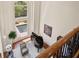 Aerial view of a stylish living room with a piano, tall windows, and lots of light at 440 Old Homestead Trl, Johns Creek, GA 30097