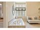 Elegant bathroom with a jetted tub at 440 Old Homestead Trl, Johns Creek, GA 30097