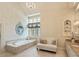 Elegant bathroom with a soaking tub and a seating area at 440 Old Homestead Trl, Johns Creek, GA 30097