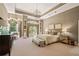 Bright main bedroom with large arched windows and built-in shelving at 440 Old Homestead Trl, Johns Creek, GA 30097