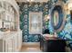 Unique powder room with custom floral wallpaper, designer mirror, and marble countertop at 440 Old Homestead Trl, Johns Creek, GA 30097
