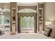 Sitting area with large windows providing natural light and views of the landscape at 440 Old Homestead Trl, Johns Creek, GA 30097