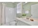 Bathroom featuring a white tub/shower combo, sink with white cabinet, and a large mirror at 8385 Sentinae Chase Dr, Roswell, GA 30076