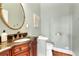 Powder room featuring a unique vanity, toilet, and neutral wall color at 8385 Sentinae Chase Dr, Roswell, GA 30076