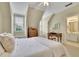 Cozy bedroom features a desk and bathroom access at 8385 Sentinae Chase Dr, Roswell, GA 30076