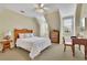 Bedroom featuring a queen size bed, wood furnishings, and windows with blinds at 8385 Sentinae Chase Dr, Roswell, GA 30076