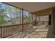 Exterior of a large wooden deck overlooking a wooded backyard, offering great outdoor living space at 8385 Sentinae Chase Dr, Roswell, GA 30076