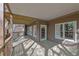 Wide wooden deck with a covered area and access to a yard, perfect for relaxation and outdoor enjoyment at 8385 Sentinae Chase Dr, Roswell, GA 30076