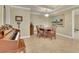 Charming dining area with a piano, a decorative chandelier, and space for a small dining table and chairs at 8385 Sentinae Chase Dr, Roswell, GA 30076