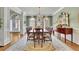 Elegant dining room with a chandelier and windows at 8385 Sentinae Chase Dr, Roswell, GA 30076