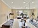 Bright, mirrored gym with treadmill, stationary bike, and ample space for a full workout at 8385 Sentinae Chase Dr, Roswell, GA 30076