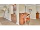 Interior shot featuring a built-in cabinet, staircase, and piano, showcasing the home's architectural details at 8385 Sentinae Chase Dr, Roswell, GA 30076