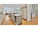 A kitchen with a large island and modern stainless steel appliances at 8385 Sentinae Chase Dr, Roswell, GA 30076