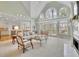 Bright living room with large windows and a fireplace at 8385 Sentinae Chase Dr, Roswell, GA 30076