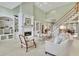 Spacious living room with fireplace, built-ins and staircase at 8385 Sentinae Chase Dr, Roswell, GA 30076