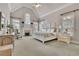 Bright and airy main bedroom with high ceilings and large windows at 8385 Sentinae Chase Dr, Roswell, GA 30076