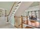 Staircase leading to a dining room at 8385 Sentinae Chase Dr, Roswell, GA 30076