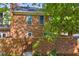 Exterior view of backyard with brick wall and foliage at 1 N Boundary Nw Pl, Atlanta, GA 30318
