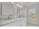 Bright bathroom with double vanity, marble countertops, and ample natural light streaming through the windows at 1 N Boundary Nw Pl, Atlanta, GA 30318