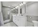 Modern bathroom featuring a double vanity, marble floors, and a glass enclosed shower with designer tile at 1 N Boundary Nw Pl, Atlanta, GA 30318